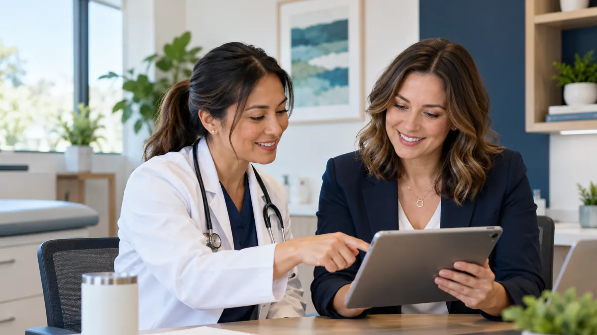 Colleagues reviewing healthcare social media: an approval-first content process together at a laptop.