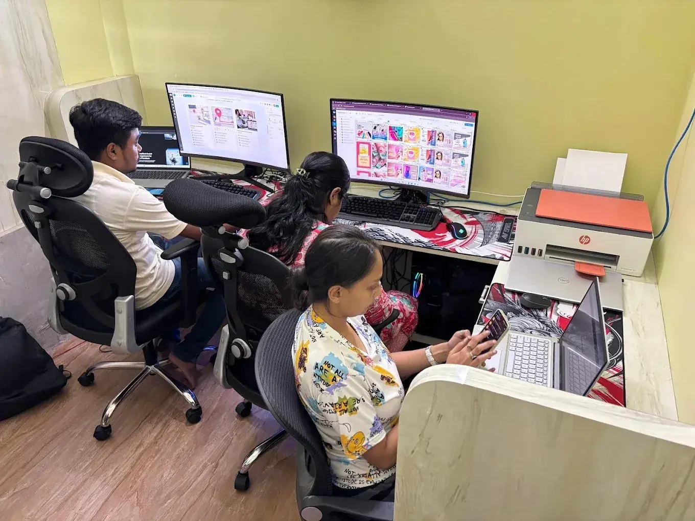 Sporteology creative team working together at a workstation